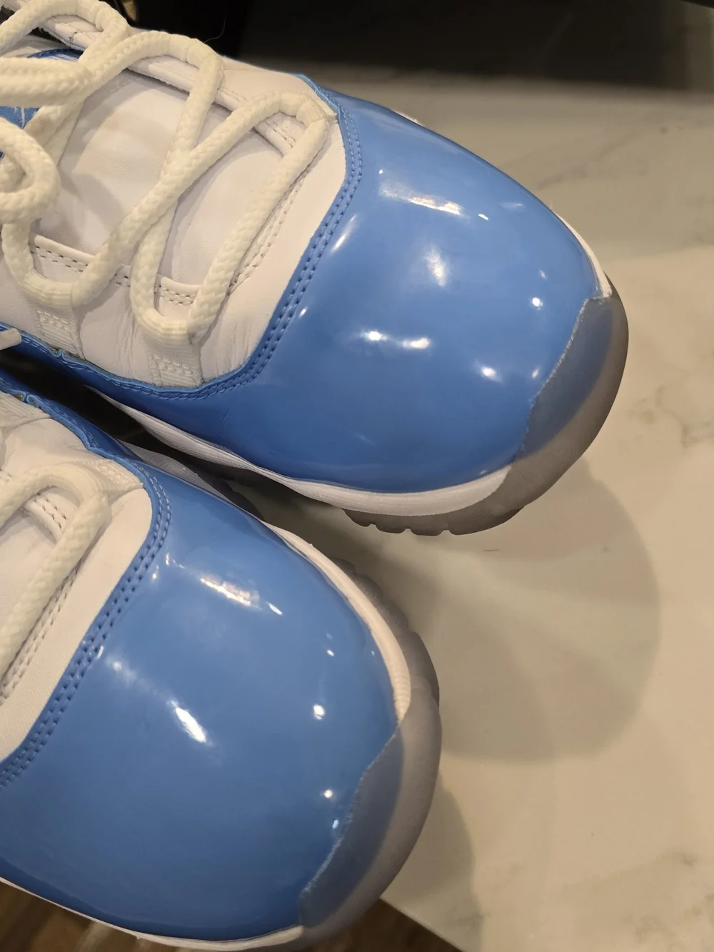 Air Jordan 11 Low Retro White and University Blue Sneakers